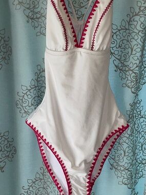White one piece swim Fully lined with pink crochet “Stitches” LIKE NEW - SMALL